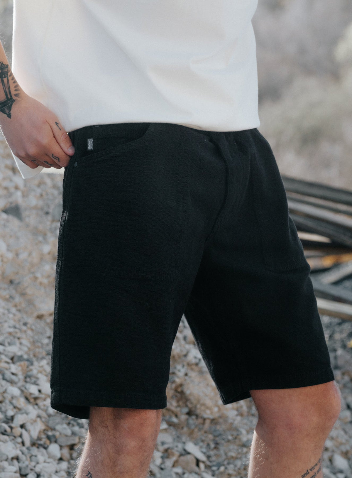 An in the field image of Men's Dissident Canvas Shorts in Obsidian Black (ITF)