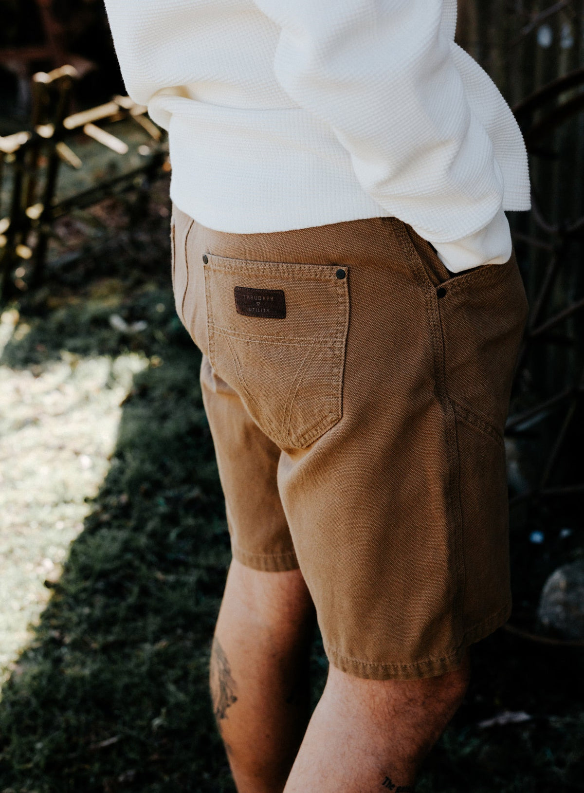 An in the field image of Men's Dissident Canvas Shorts in Coyote Brown (ITF)