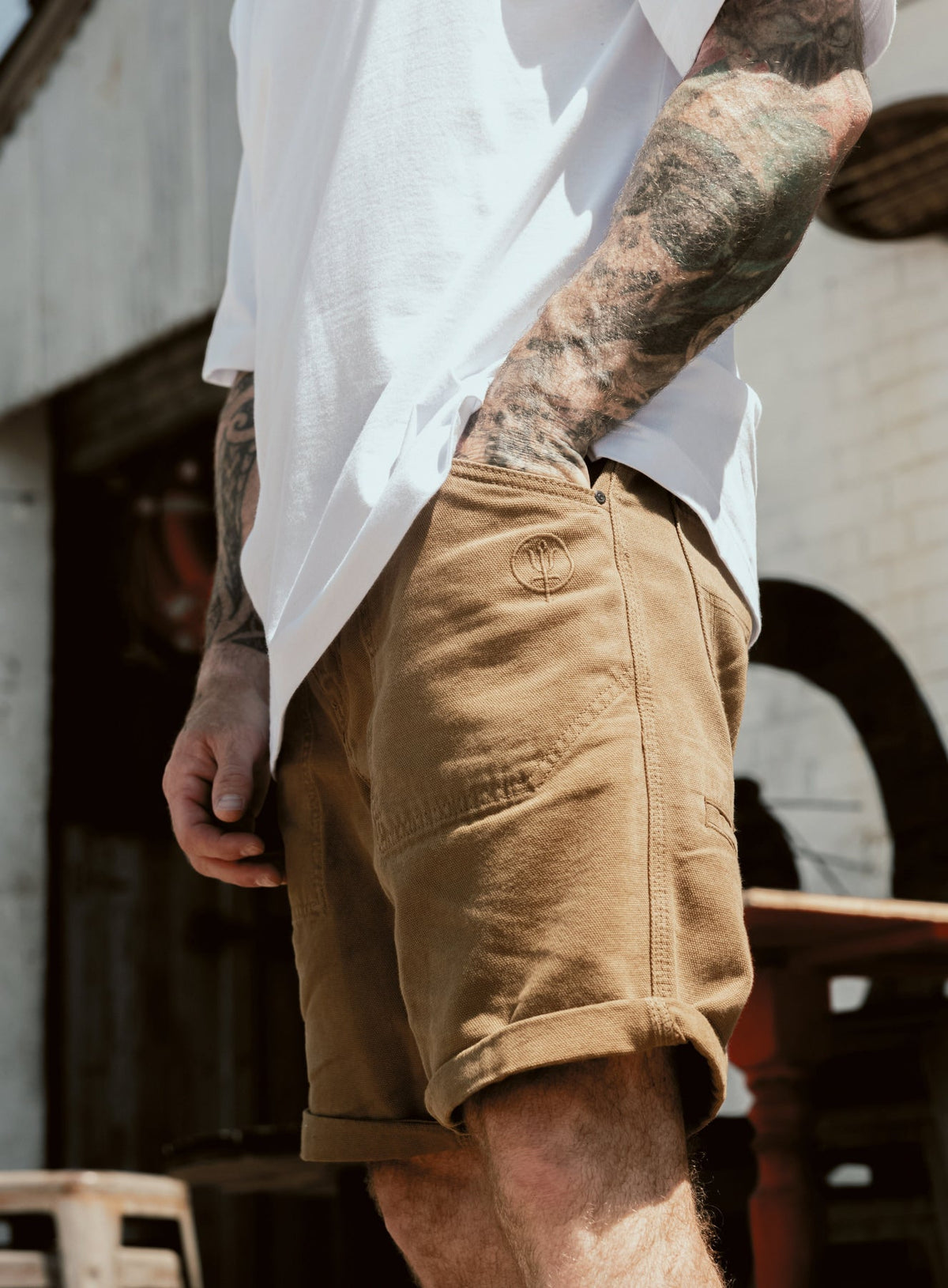 An in the field image of Men's Dissident Canvas Shorts in Coyote Brown (ITF)