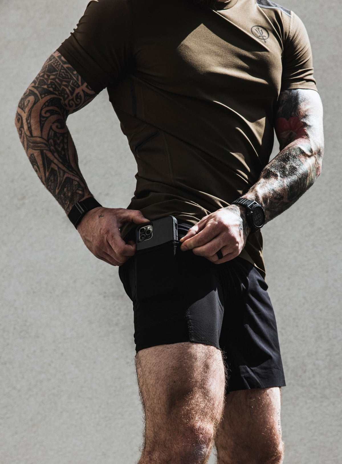 An in the field image of Men's Force Velocity 2-In-1 Short in Obsidian Black (ITF)
