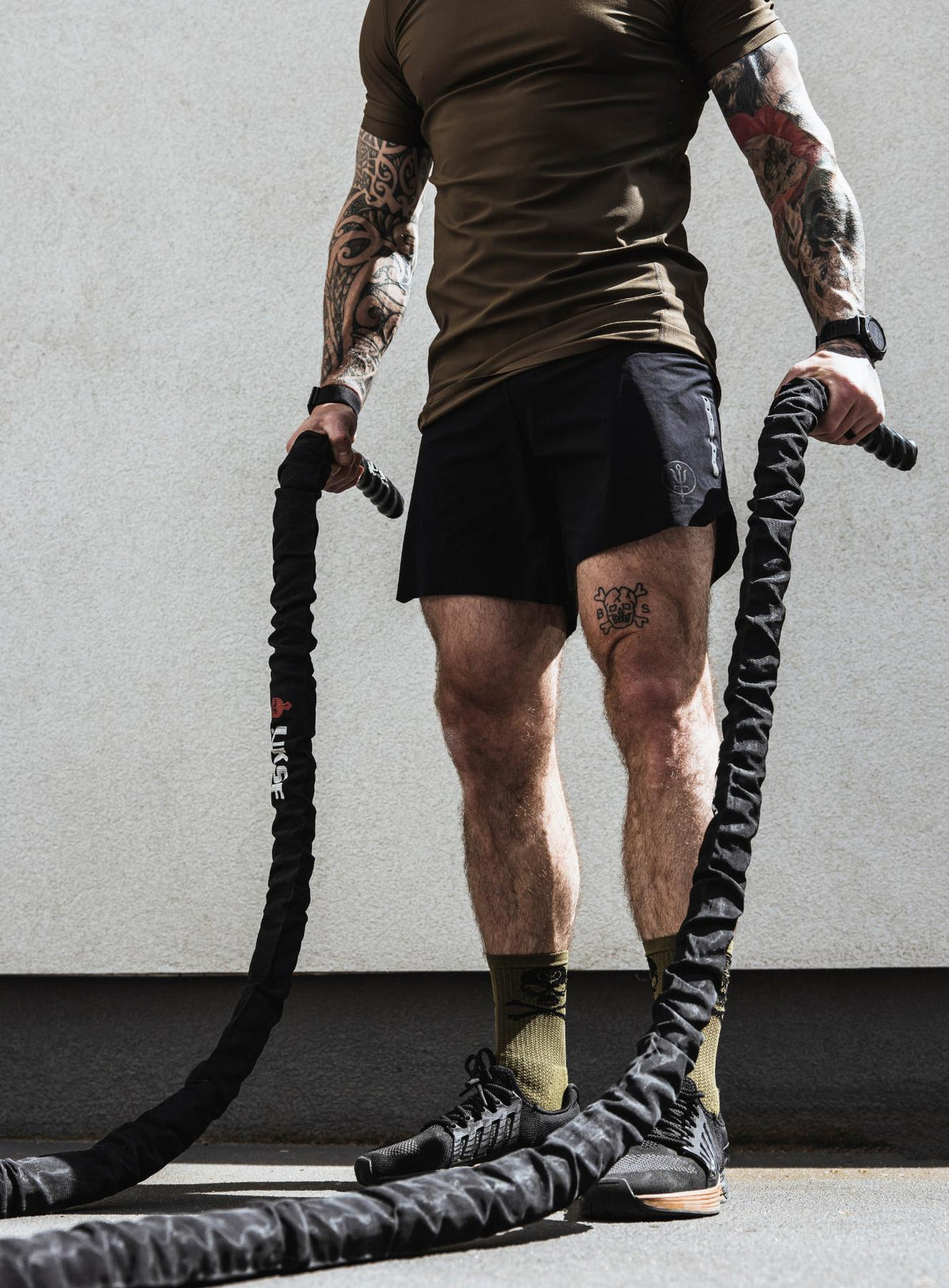 An in the field image of Men's Force Velocity 2-In-1 Short in Obsidian Black (ITF)