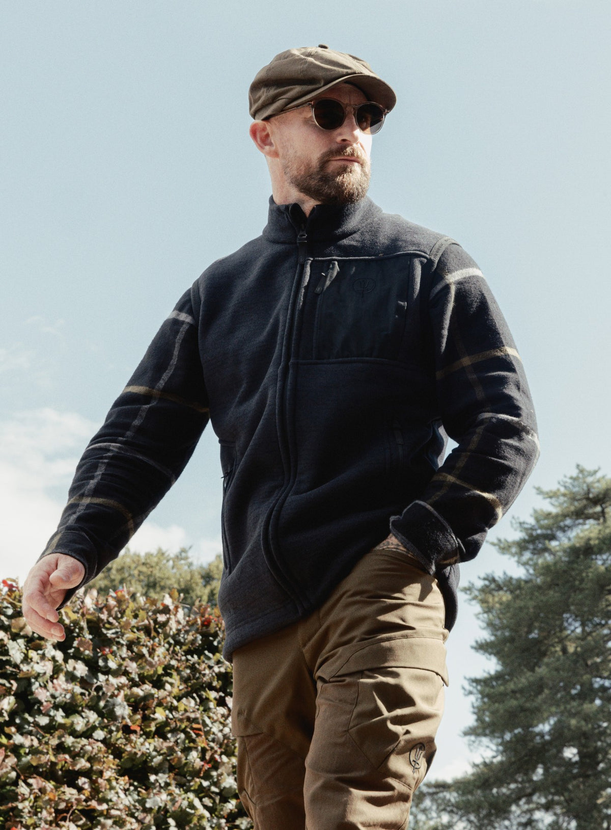 An in the field image of Men's HeriTech Moorland Fleece Gilet in Obsidian Black (ITF)