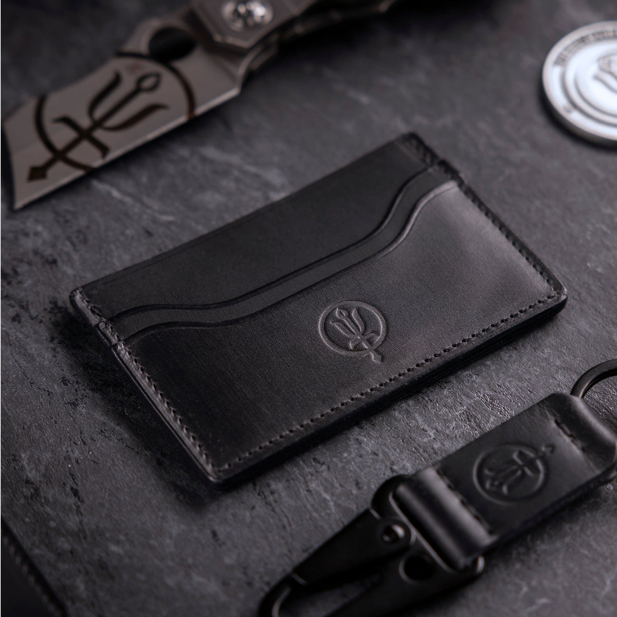 A creative studio shot of Leather Cardholder Wallet in Black (CS)