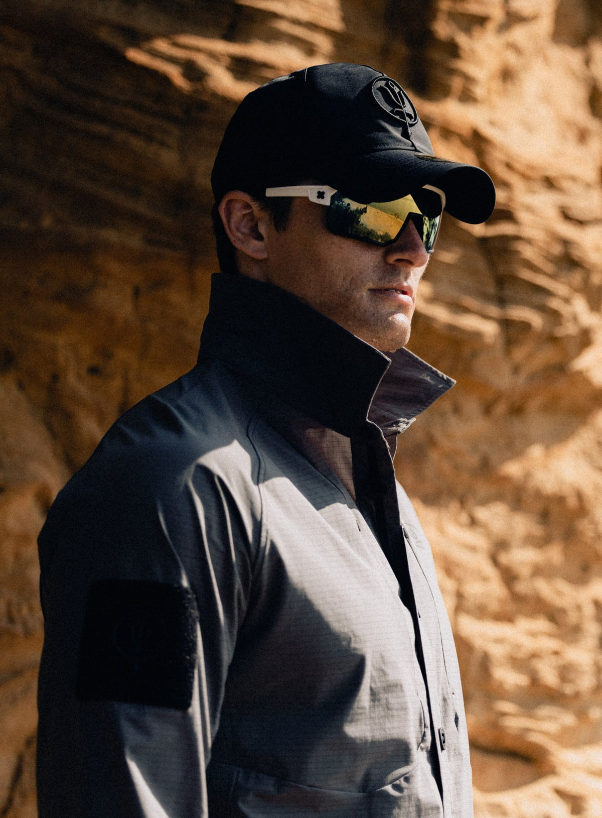 An in the field image of Men's New Era Desert Gore-Tex 9twenty Cap in Obsidian Black (ITF)