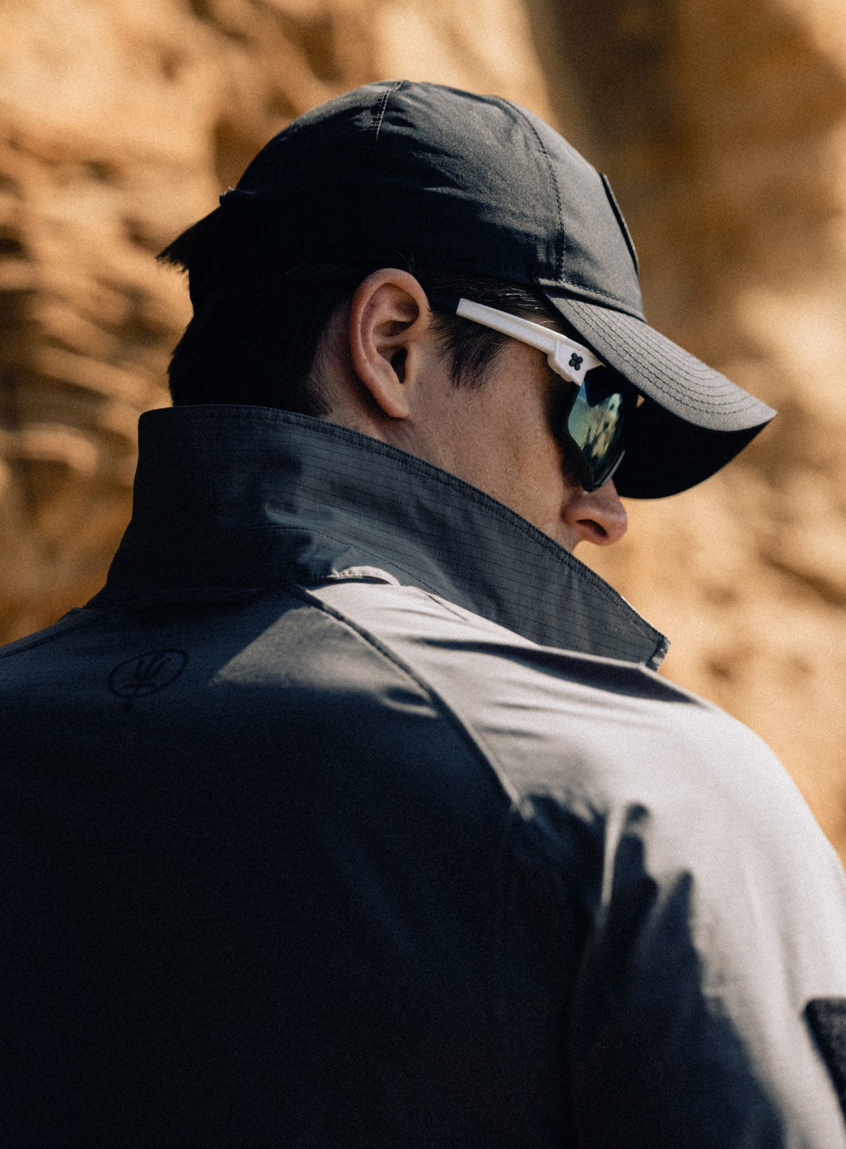 An in the field image of Men's New Era Desert Gore-Tex 9twenty Cap in Obsidian Black (ITF)