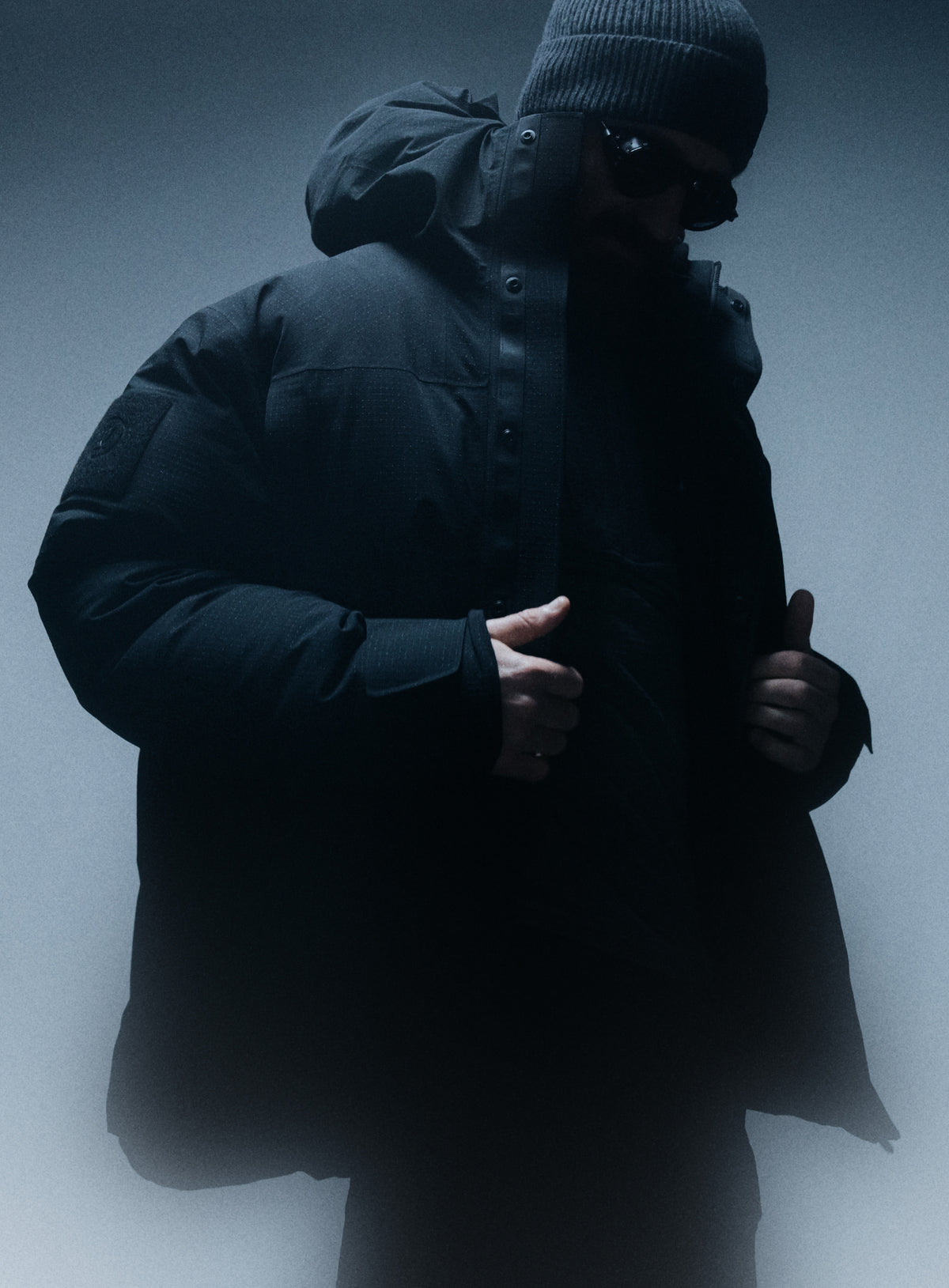 A creative studio shot of Men's Palisade Down Insulated Jacket in Obsidian Black (CS)