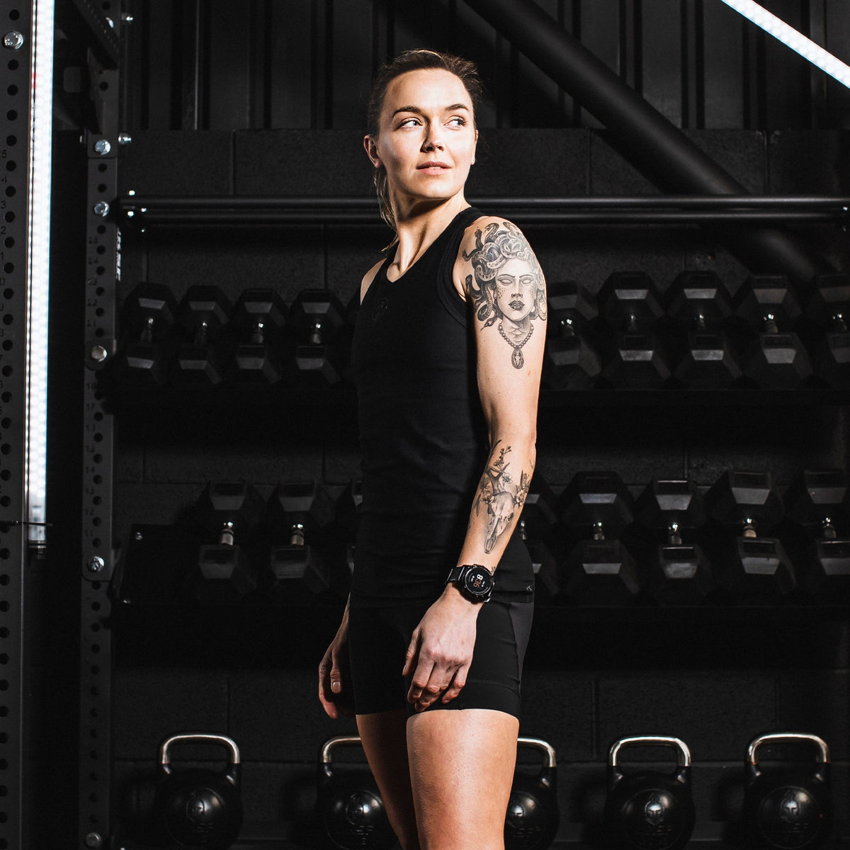 An in the field image of Women's Force Velocity Vest in Obsidian Black (ITF)