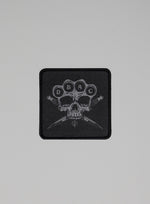 A studio shot of DBAC Patch in Obsidian Black (SS)