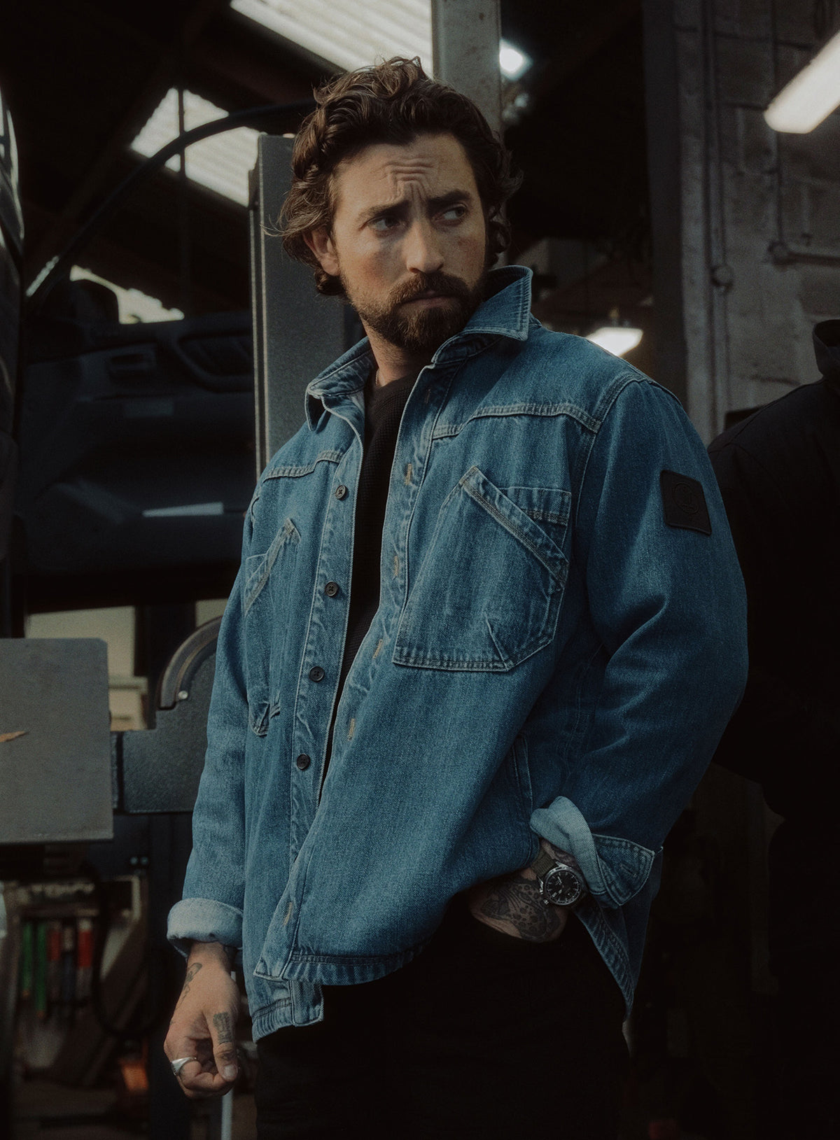 An in the field image of Men's Dissident Denim Overshirt in Navy (ITF)