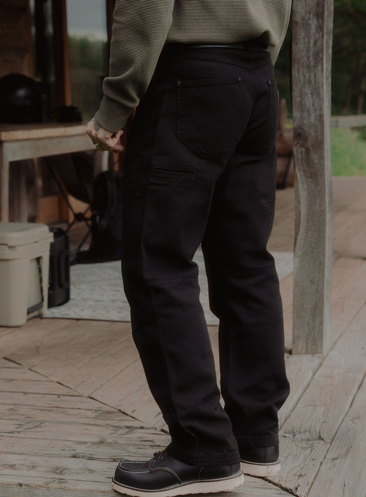 An in the field image of Men's Dissident Canvas Trousers in Obsidian Black (ITF)