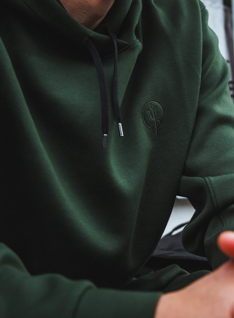 A studio shot of Force Catalyst Hoodie in Forest Green (SS)