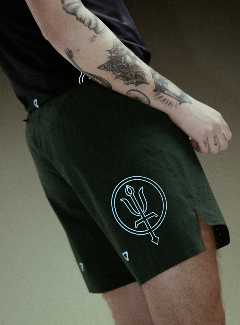 An in the field image of Force Trail Running 7" Shorts in Forest Green (ITF)