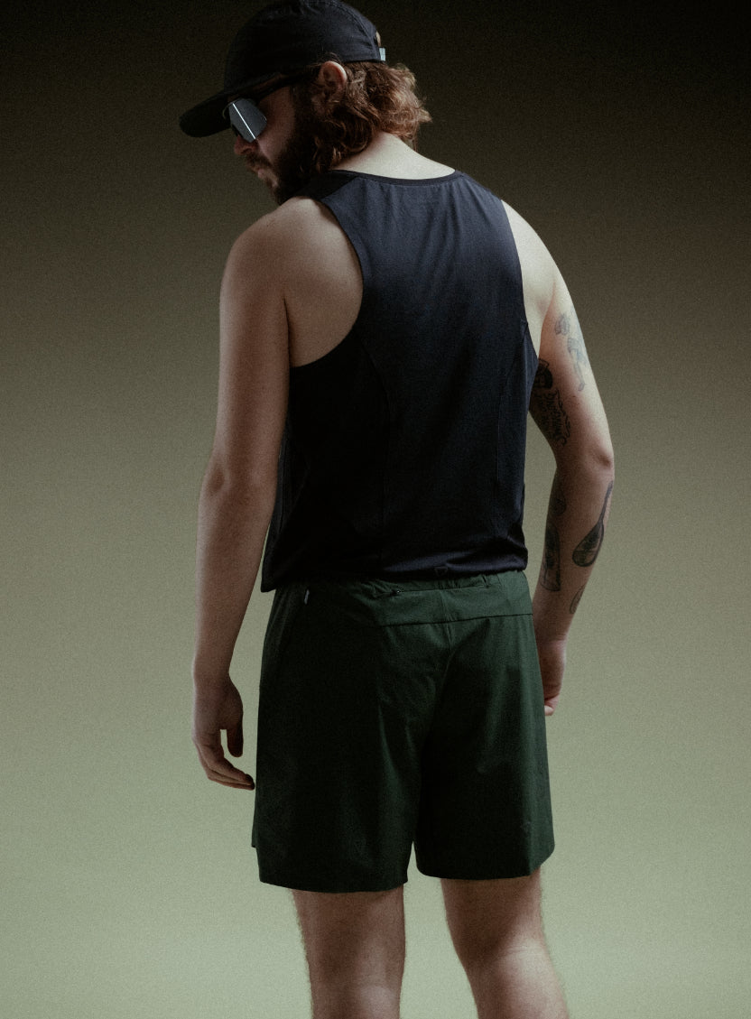 A creative studio shot of Force Trail Running 7" Shorts in Forest Green (CS)