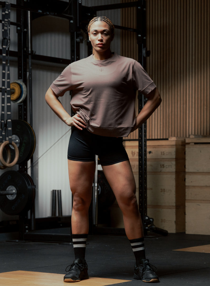 An in the field image of Women's Force Boxy DriRelease T-Shirt in Purple (ITF)