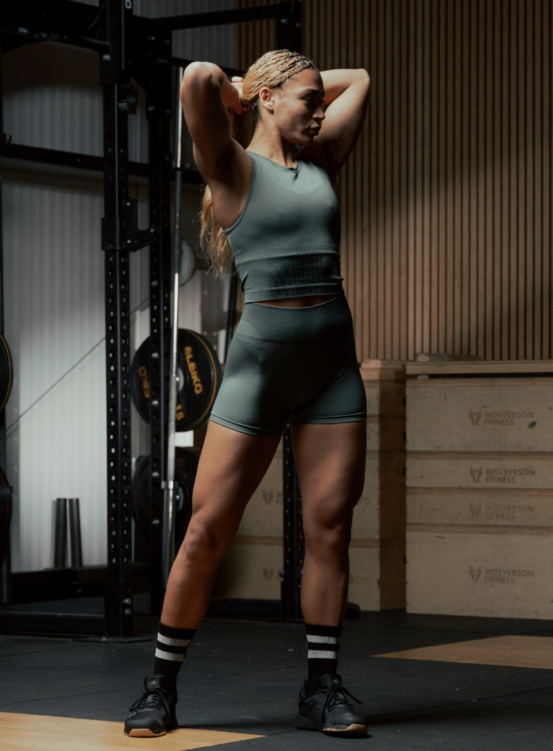 An in the field image of Women's Force Seamless Shorts in Urban Green (ITF)