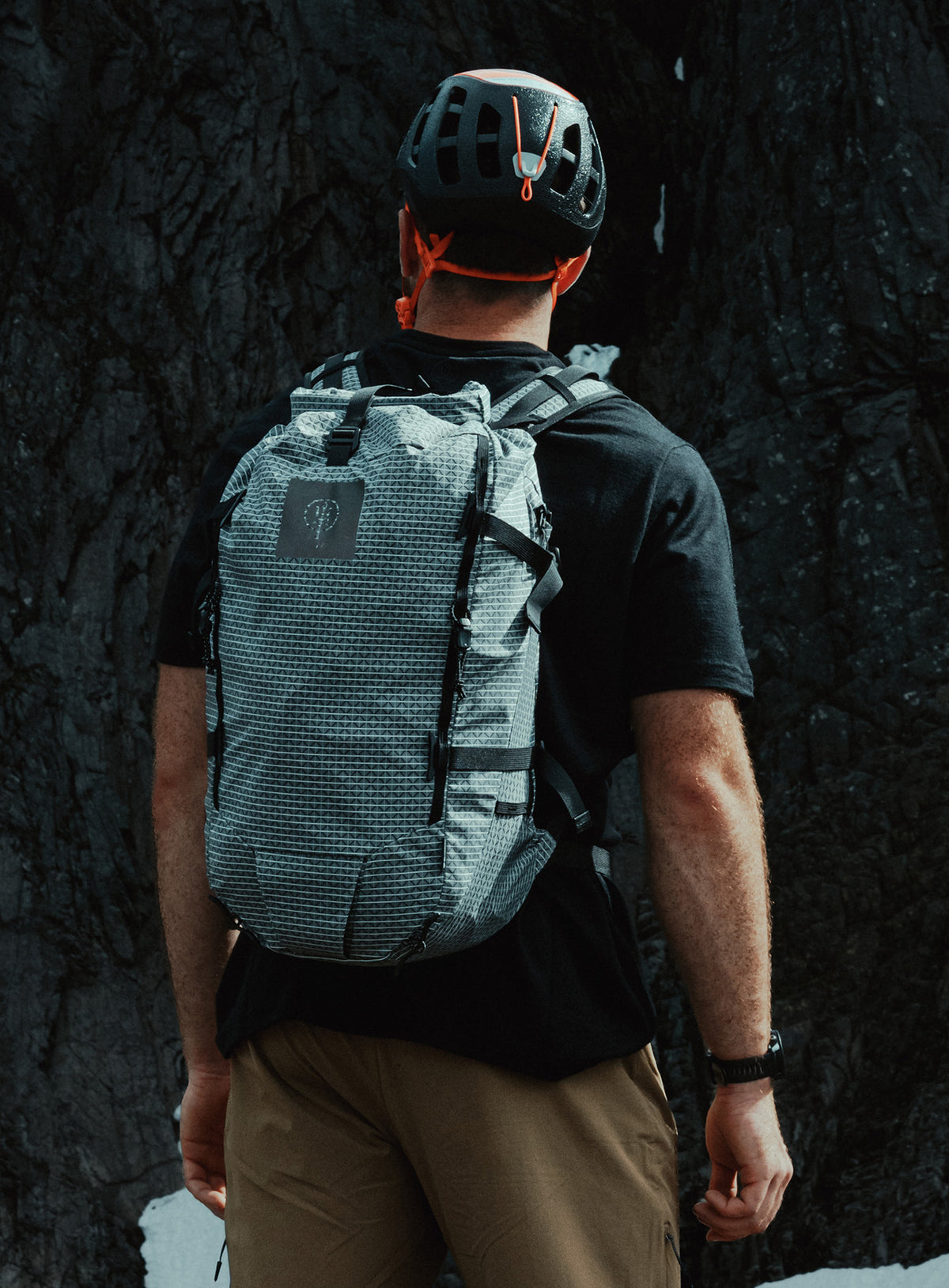 An in the field image of Orbital 30L Dyneema Climbing Backpack in Antimony Grey (ITF)