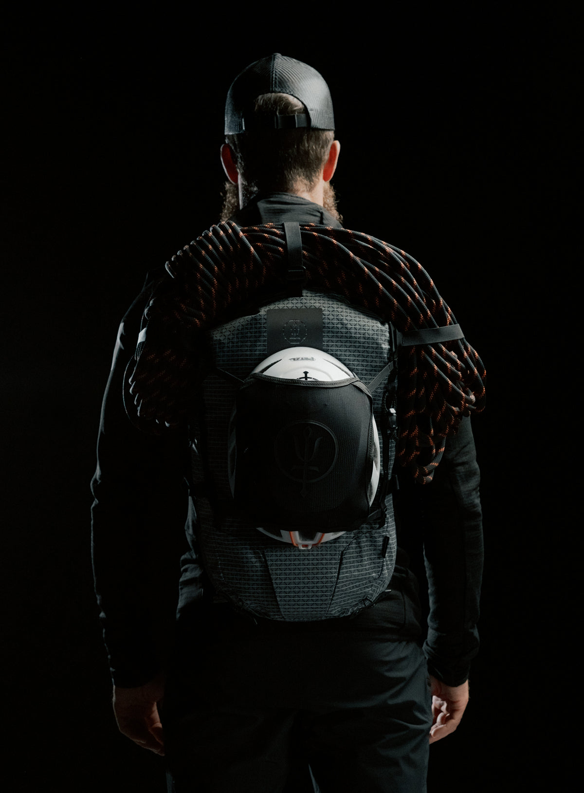 A creative studio shot of Orbital 30L Dyneema Climbing Backpack in Antimony Grey (CS)