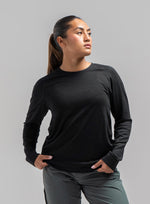 A studio shot of Women's Oryon 72HR Merino Long Sleeve T-Shirt in Obsidian Black (SS)
