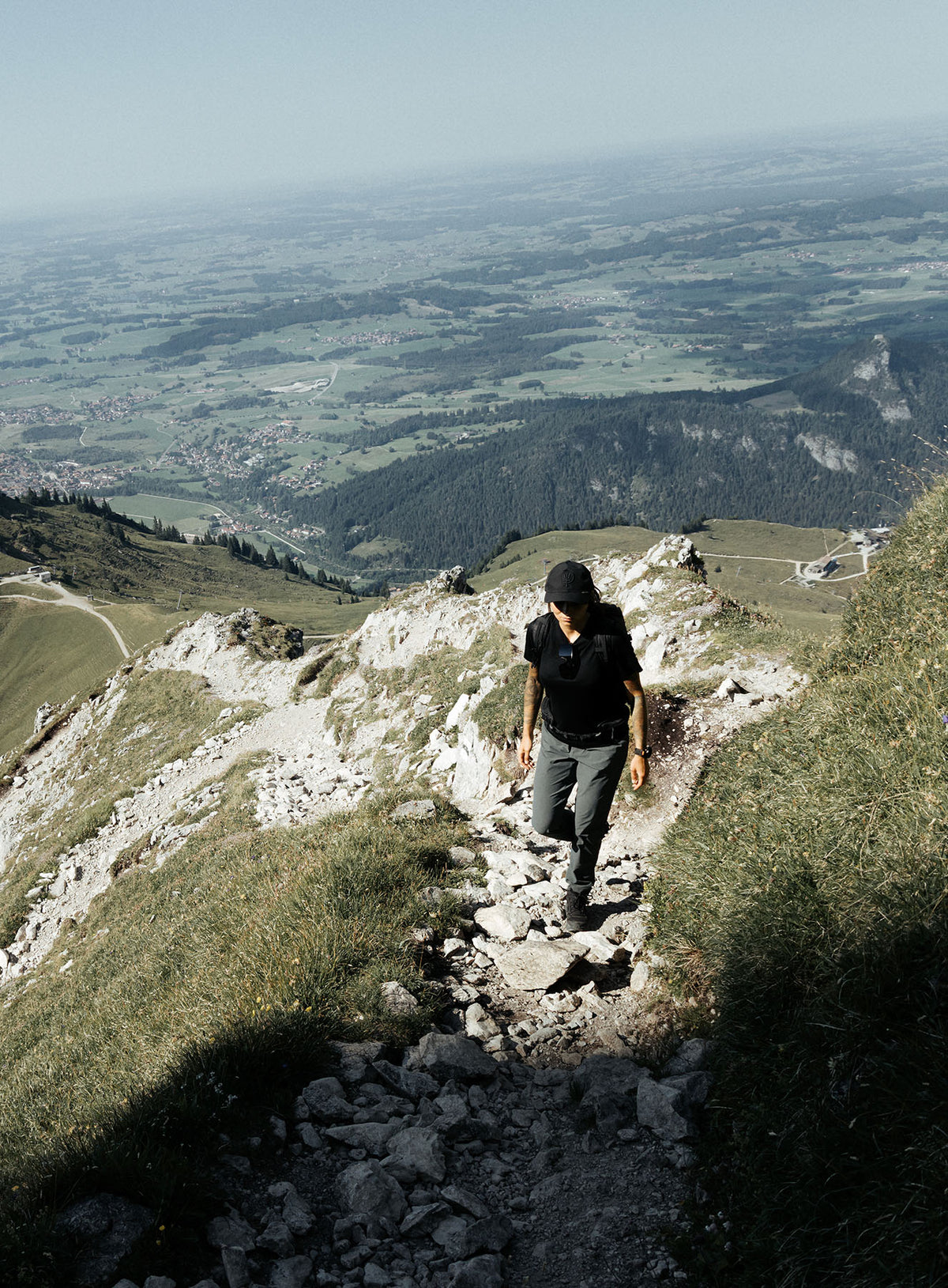 An in the field image of Women's Oryon 72HR Merino T-Shirt in Obsidian Black (ITF)