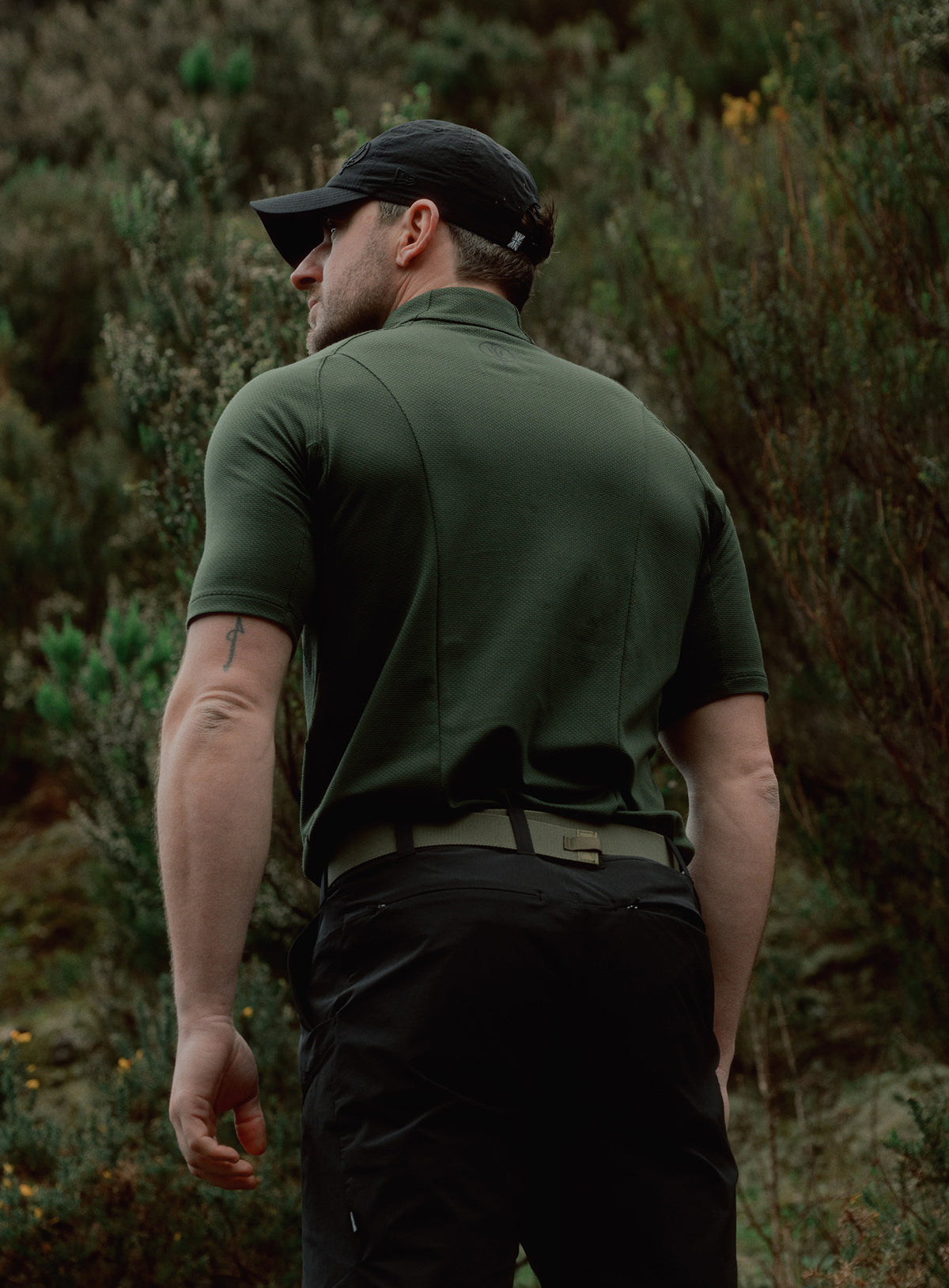 An in the field image of Men's Oryon Delta T-Shirt in Forest Green (ITF)