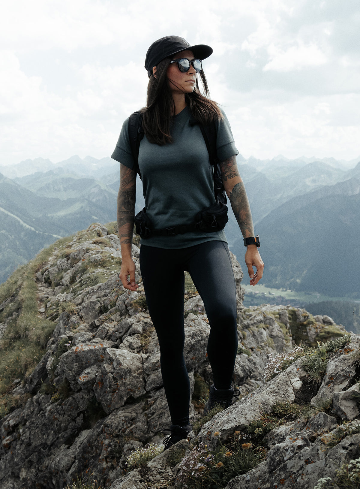 An in the field image of Women's Oryon Leggings in Obsidian Black (ITF)