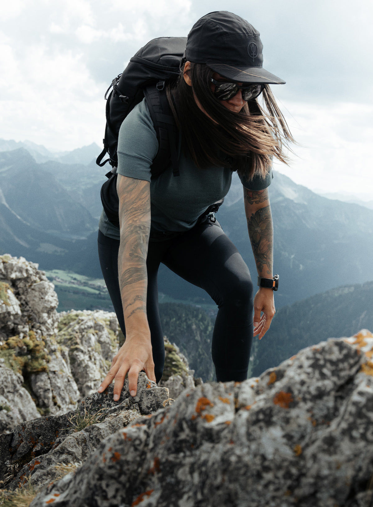 An in the field image of Women's Oryon Leggings in Obsidian Black (ITF)