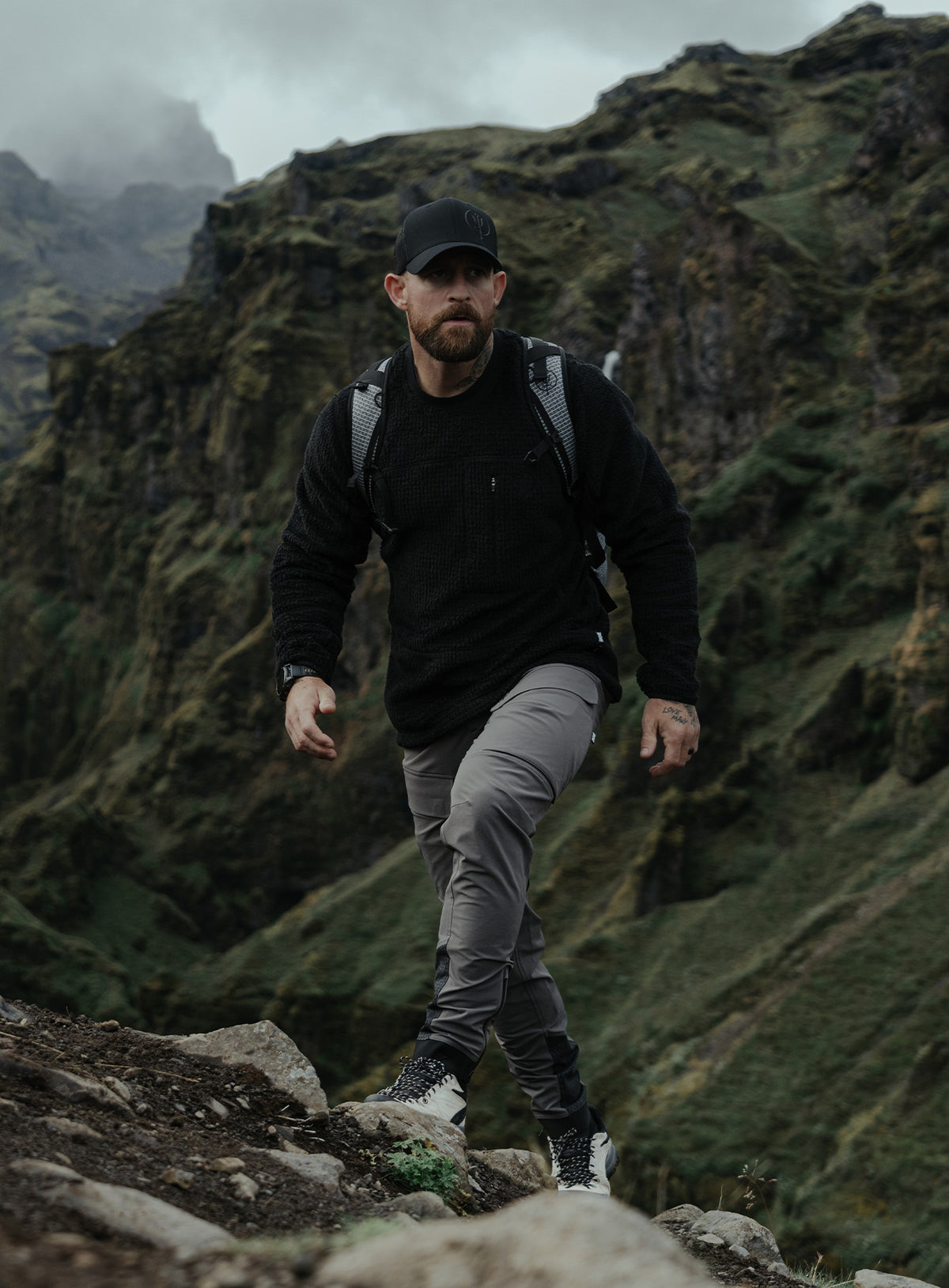 An in the field image of Phalanx Crew Fleece in Obsidian Black (ITF)