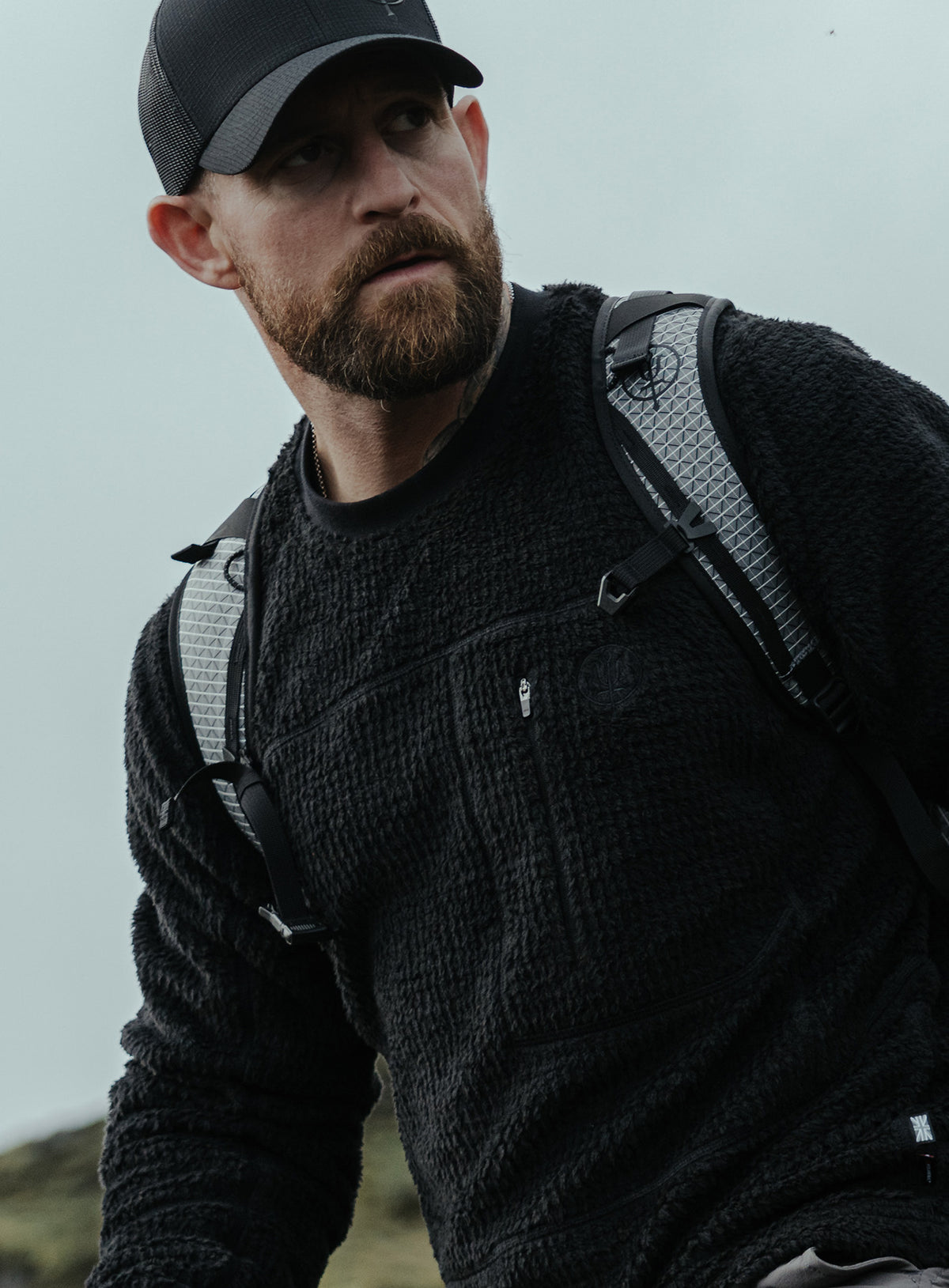 An in the field image of Phalanx Crew Fleece in Obsidian Black (ITF)