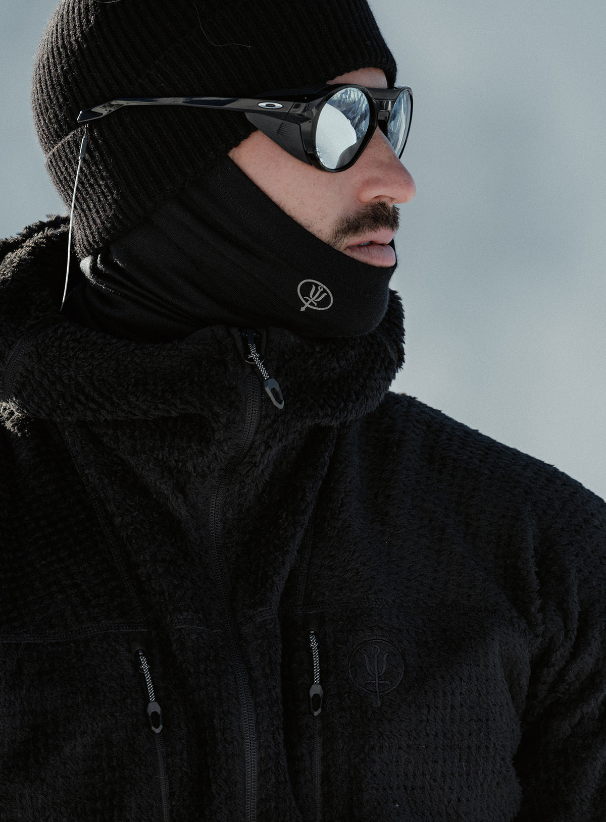 A creative studio shot of Phalanx Hooded Fleece in Obsidian Black (CS)