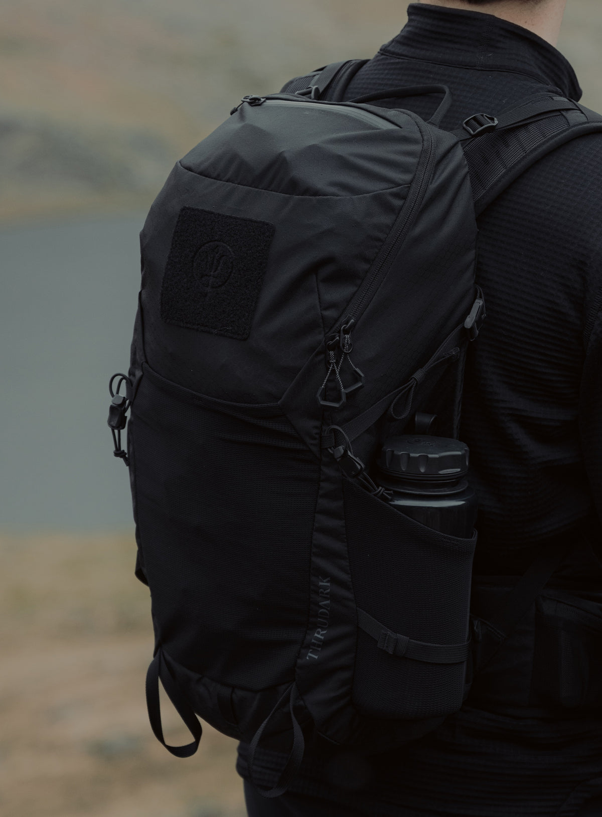 An in the field image of Pinnacle 28L Hiking Backpack in Obsidian Black (ITF)