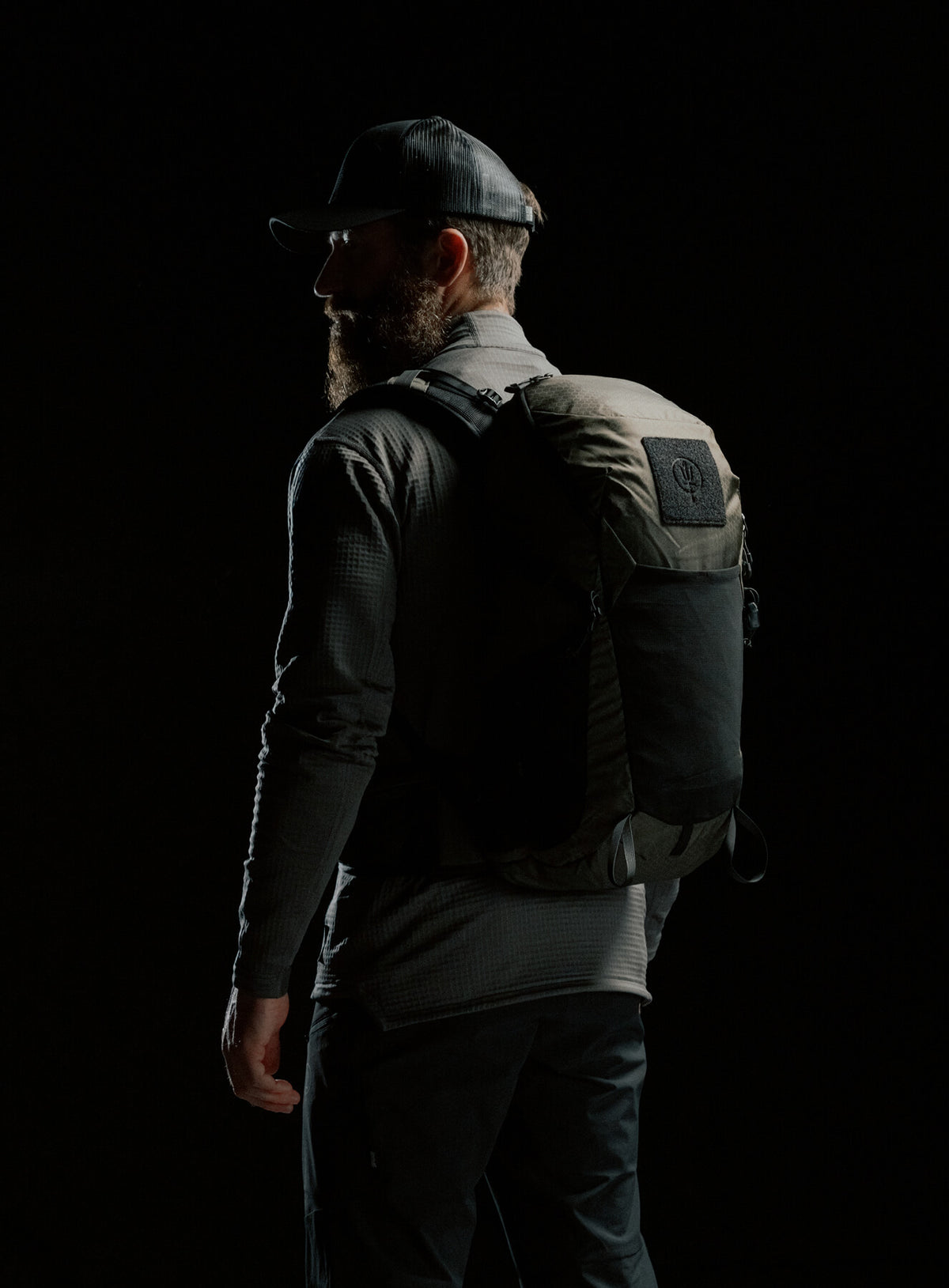 A creative studio shot of Pinnacle 28L Hiking Backpack in Olive Green (CS)