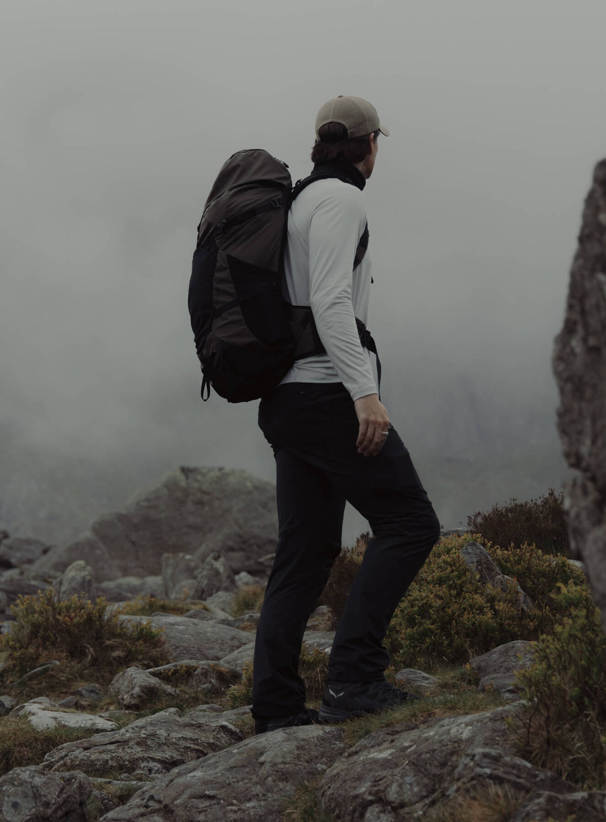 An in the field image of Pinnacle 42L Hiking Backpack in Obsidian Black (ITF)