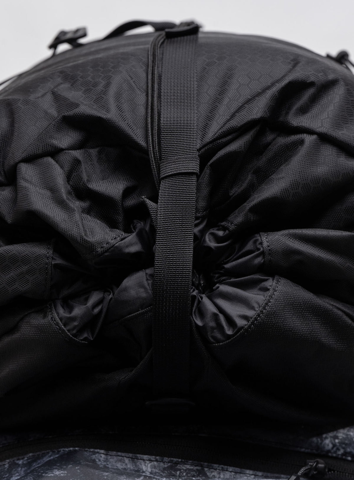 Adjustable Toggle Access to Main Compartment