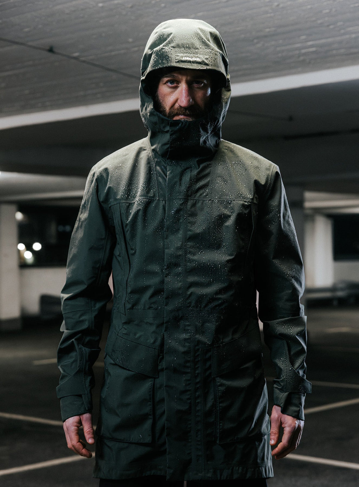 An in the field image of Men's Renegade Parka in Forest Green (ITF)