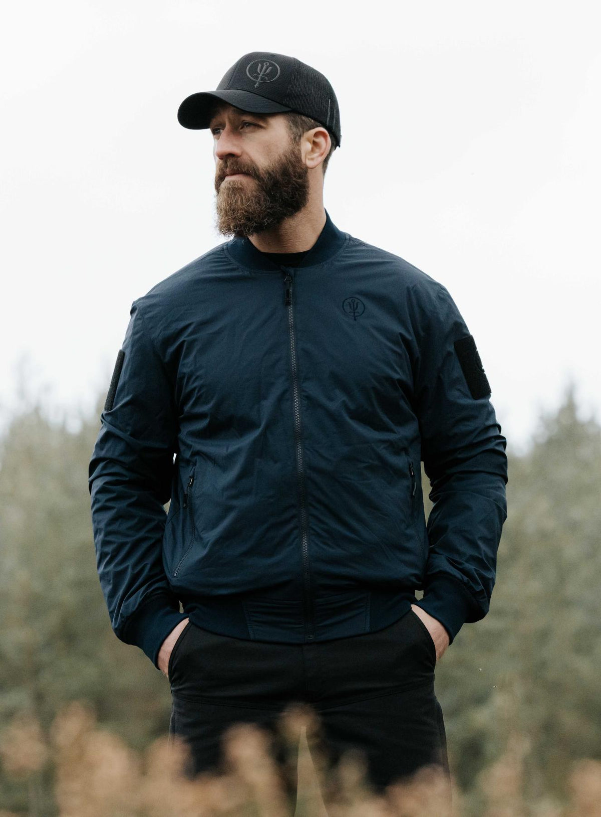 An in the field image of Men's Wraith Bomber Jacket in Dark Sapphire (ITF)