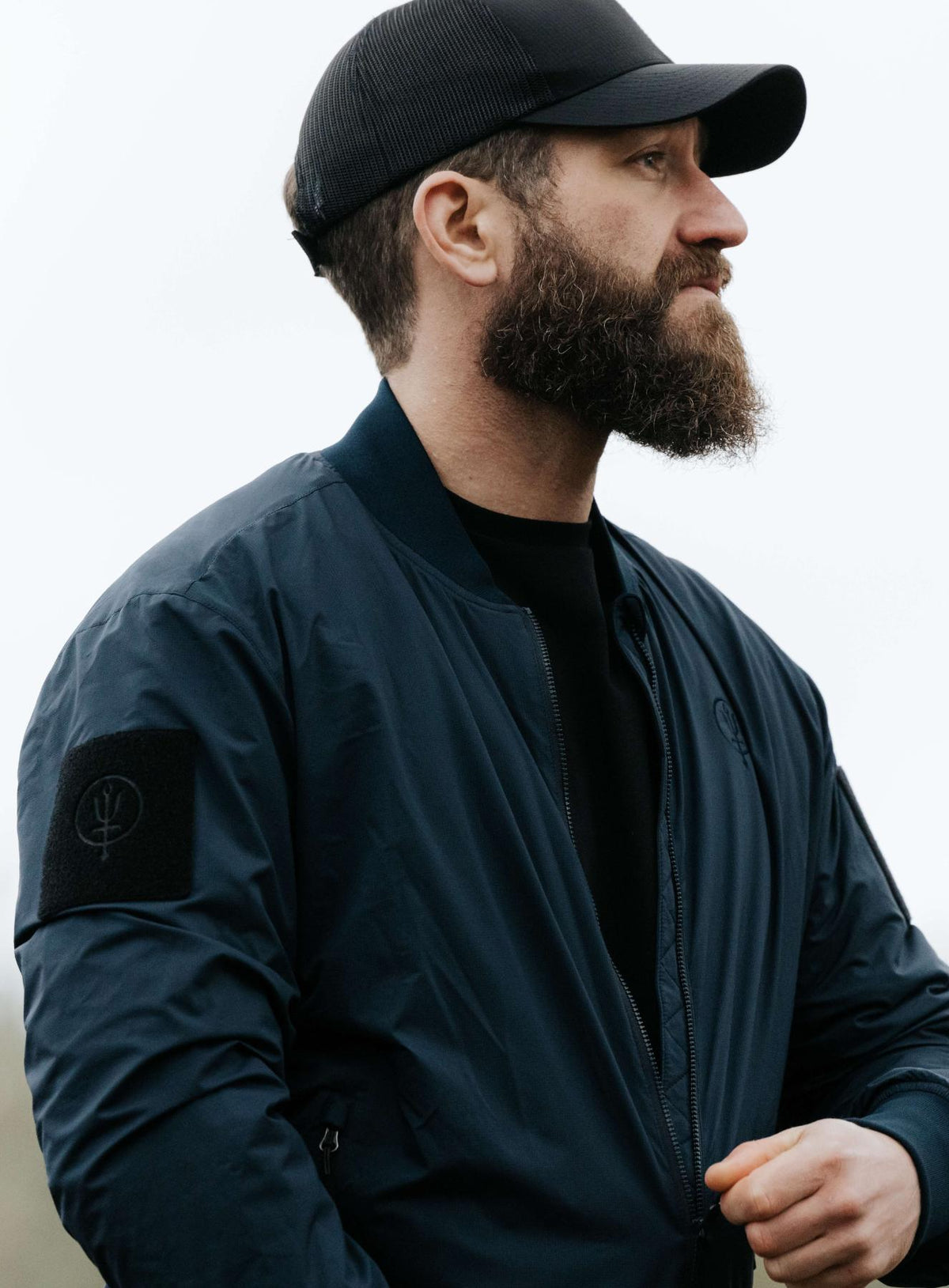 An in the field image of Men's Wraith Bomber Jacket in Dark Sapphire (ITF)