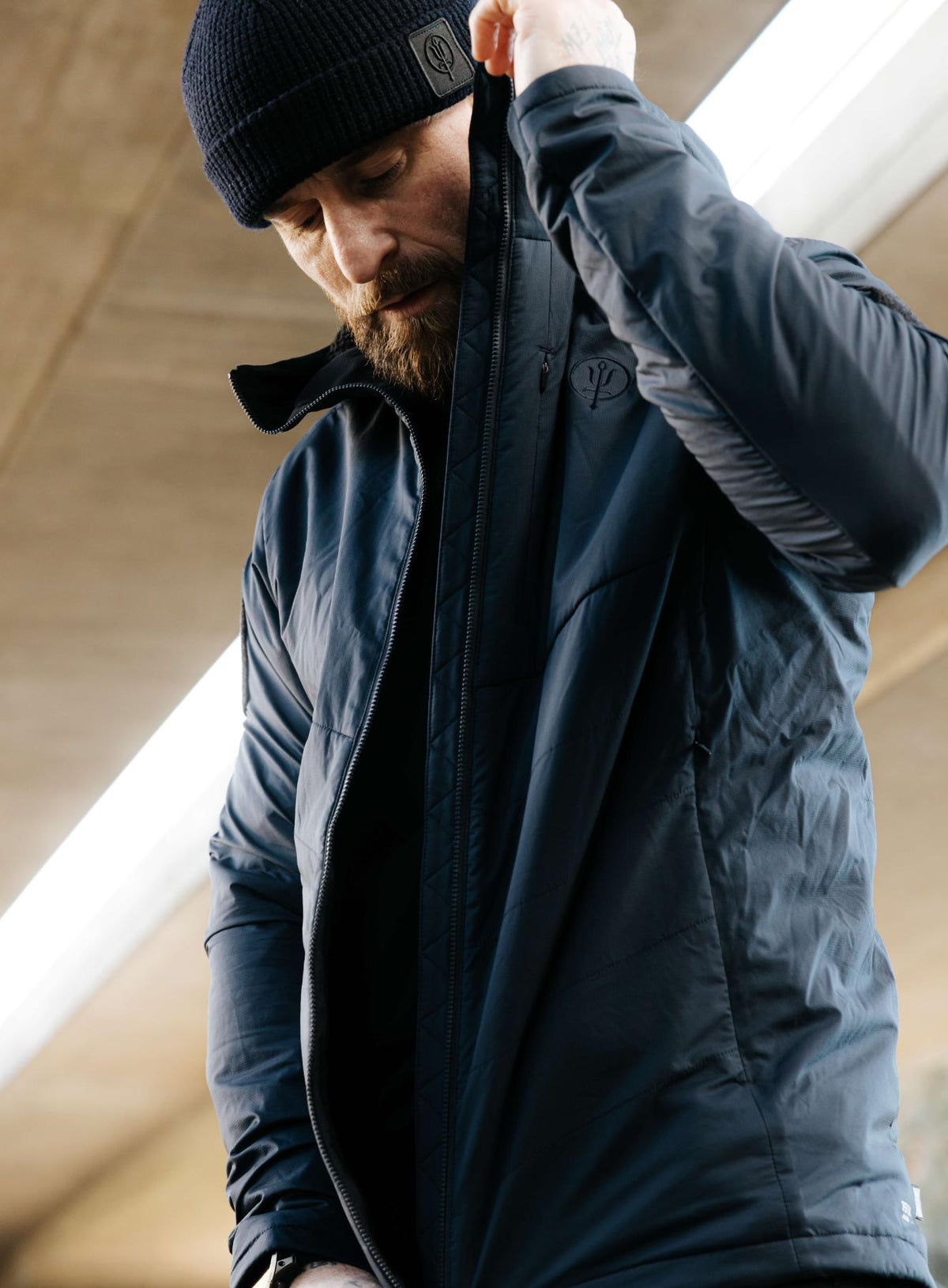 An in the field image of Men's Wraith Hooded Jacket in Dark Sapphire (ITF)