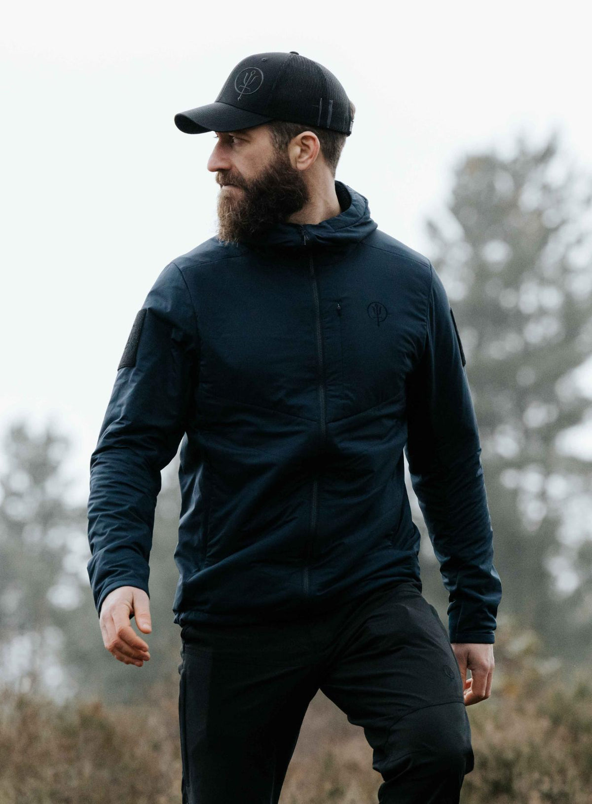 An in the field image of Men's Wraith Hooded Jacket in Dark Sapphire (ITF)